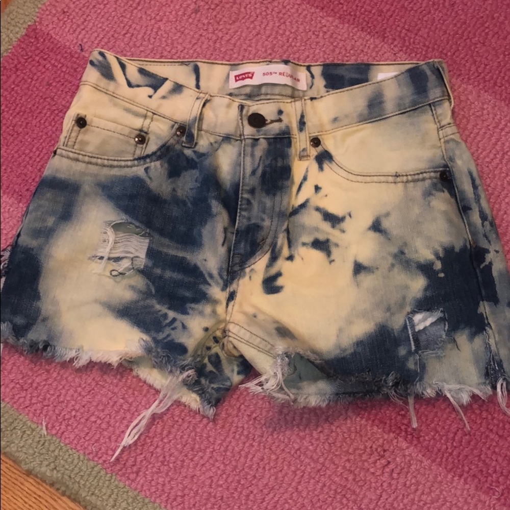 Bleached and distressed Levi’s jean shorts